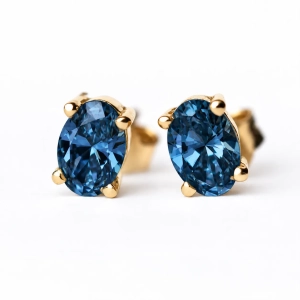 Złote kolczyki z topazem London Blue – widok główny – ABGOLD Baczyński