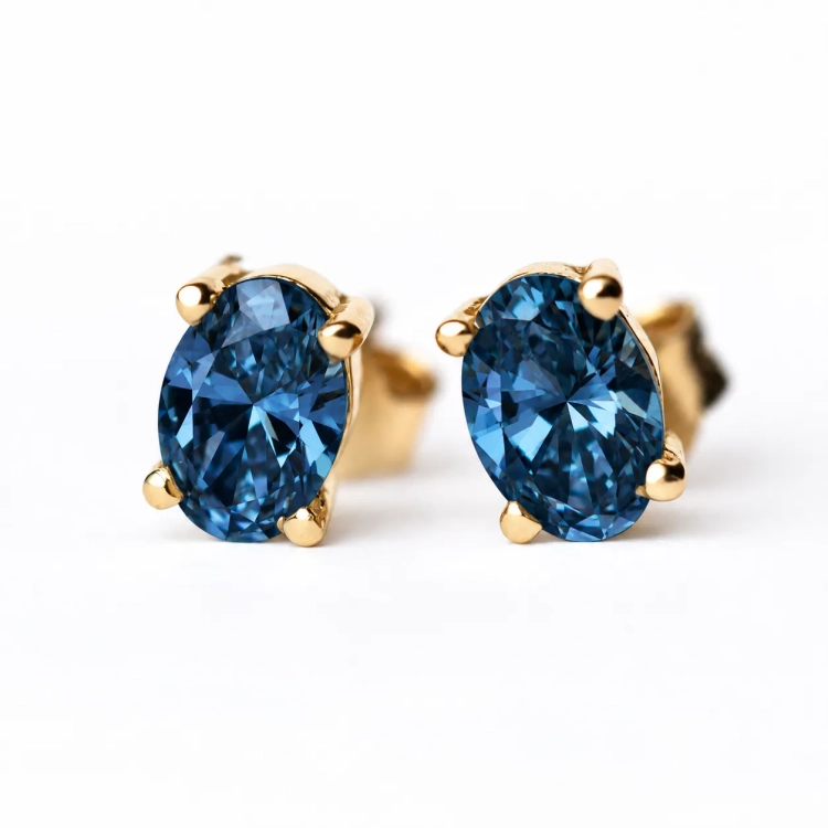 Złote kolczyki z topazem London Blue – widok główny – ABGOLD Baczyński